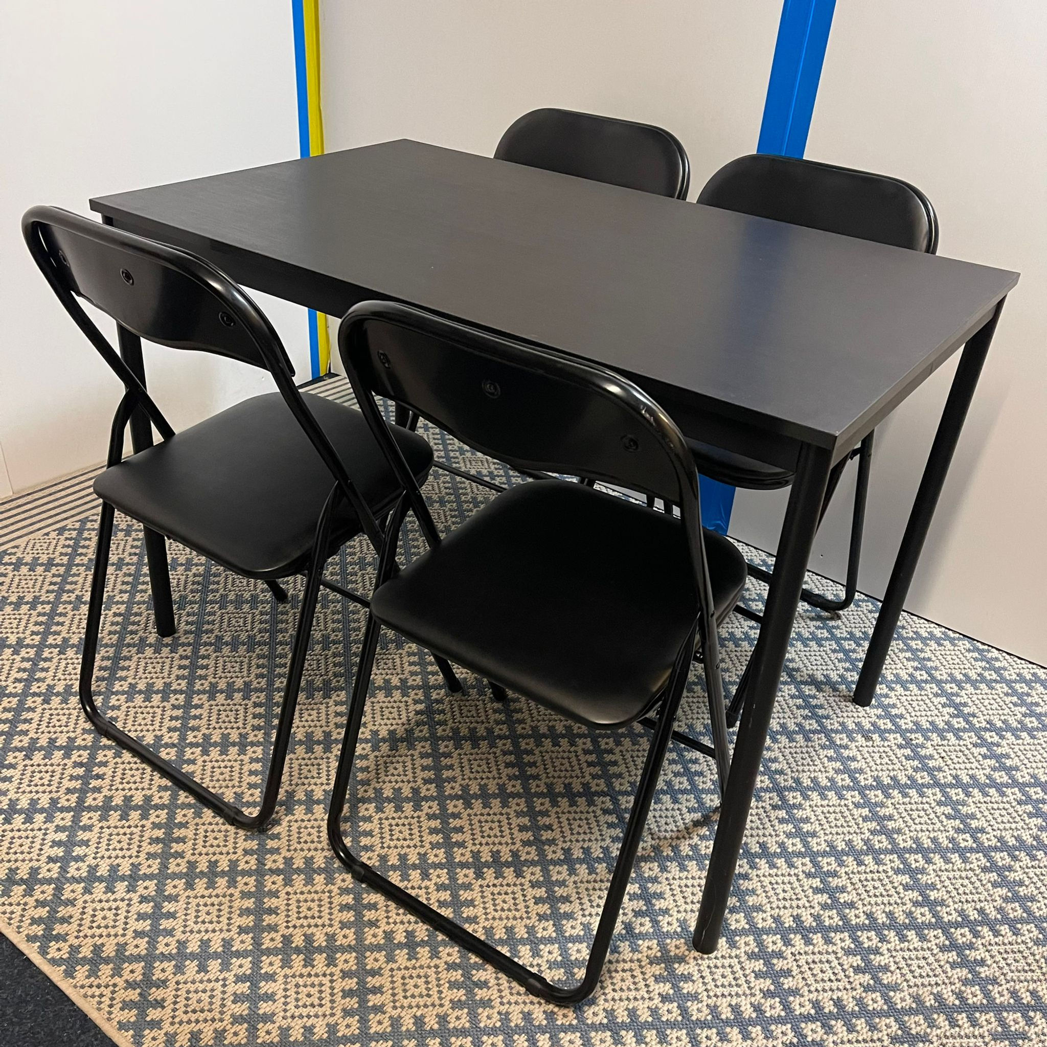 Black dining table with 4 chairs, in good condition. 