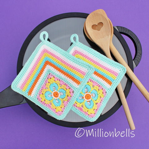 Thumbnail: Brightly colored crocheted pot holders on top of skillet