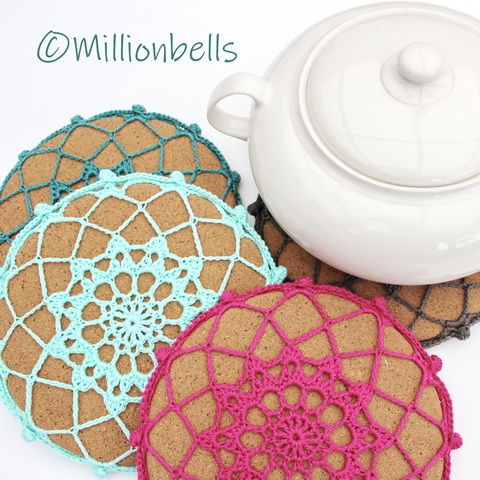 Thumbnail: Detail white pot with crochet covered cork hot pads
