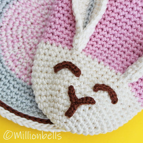 Thumbnail: Close up crocheted bunny face in cream and pink