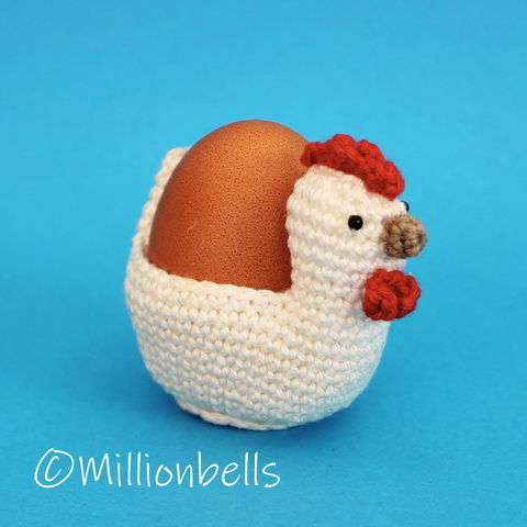 Thumbnail: Crochet chicken egg cosy holding a real chicken egg