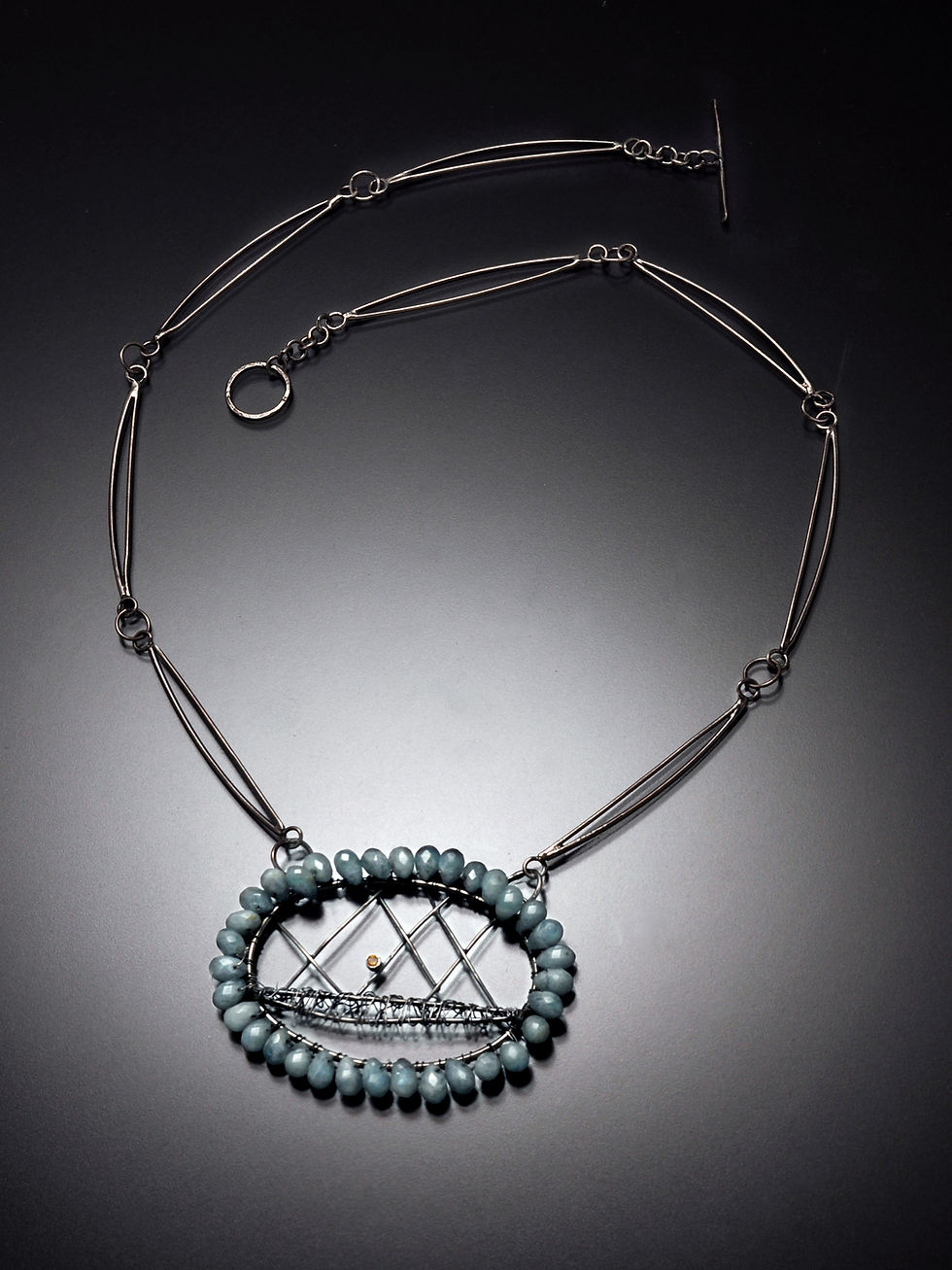 Silver necklace with ship design and blue beads. RC Studio Jewelry