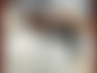 Hands exchange white and black shopping bags. "rc studio jewelry" text is visible. Indoor setting with blurred background.