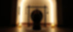 Casey's backlit silhouette in hero's pose, in front of the gong at TruFusion Post Oak