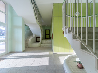 Building entrance hall decorated in shades of green