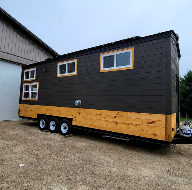 Wood siding tiny house. Stained wood accent tiny home. Custom tiny house build. Wisconsin tiny home. Tiny house living wisconsin.