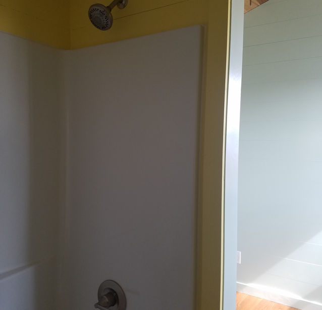 Full bathtub and shower in tiny house, custom tiny house designs, wisconsin