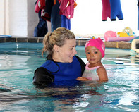 Rikki with swimming toddler