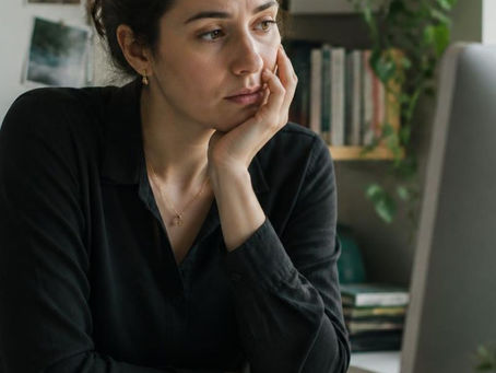 Employee dealing with brain fog at work after a difficult season