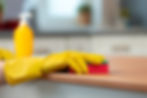 unrecognizable-woman-in-yellow-gloves-wiping-woode-2025-02-25-02-14-51-utc.jpg