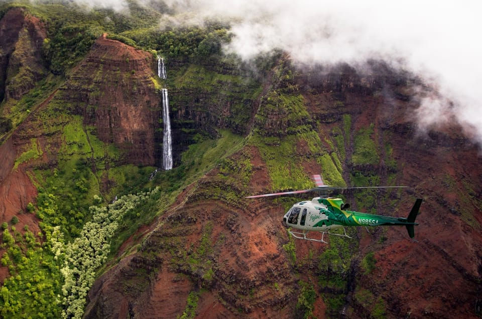A helicopter flying near the Na Pali Coast of Kauai.