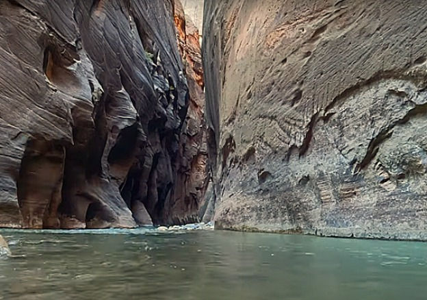 The towering narrow walls of the Narrows near Wall Street on the Virgin River of Zion National Park.