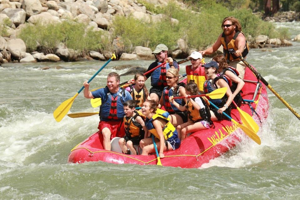 A family headed down the modest rapids on the Yellowstone River.