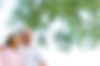 Elderly Asian couple enjoying time together outside under some trees