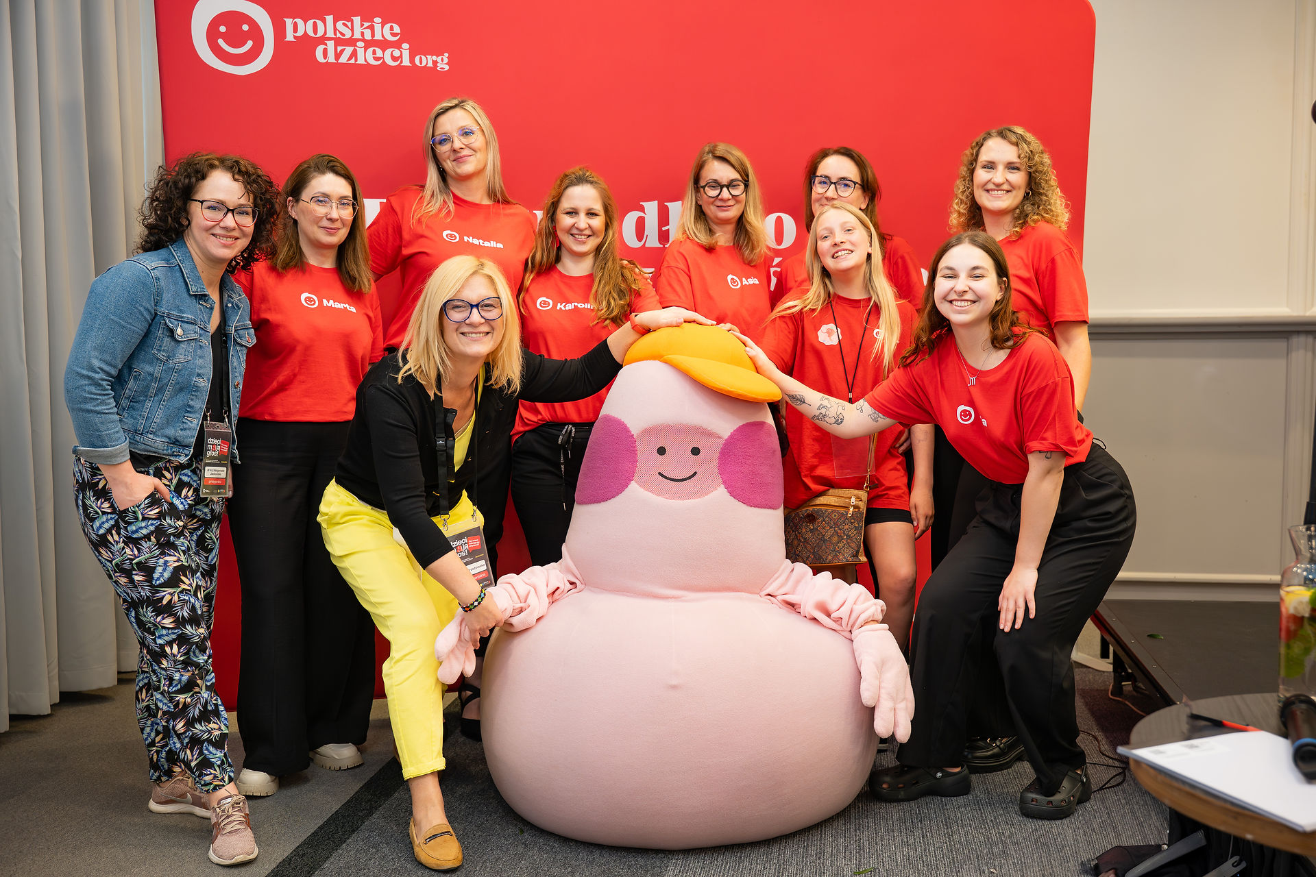 Polskiedzieci's team and mascot at the conference in Poland