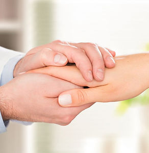 Caring Doctor holding patient's hands.jpg