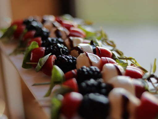Delicious arrangement of fruits, cheeses, meats, crackers, and sauces