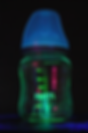 Glowing green baby bottle