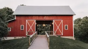 Vintage Rose Barn in Gobles, MI - Big red barn with white trim with a ramp heading straight into it
