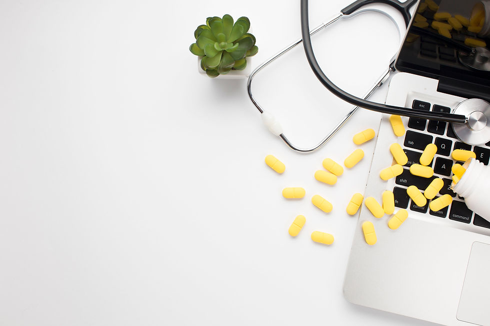 elevated-view-spilled-pills-stethoscope-laptop-with-succulent-plant-isolated-white-surface