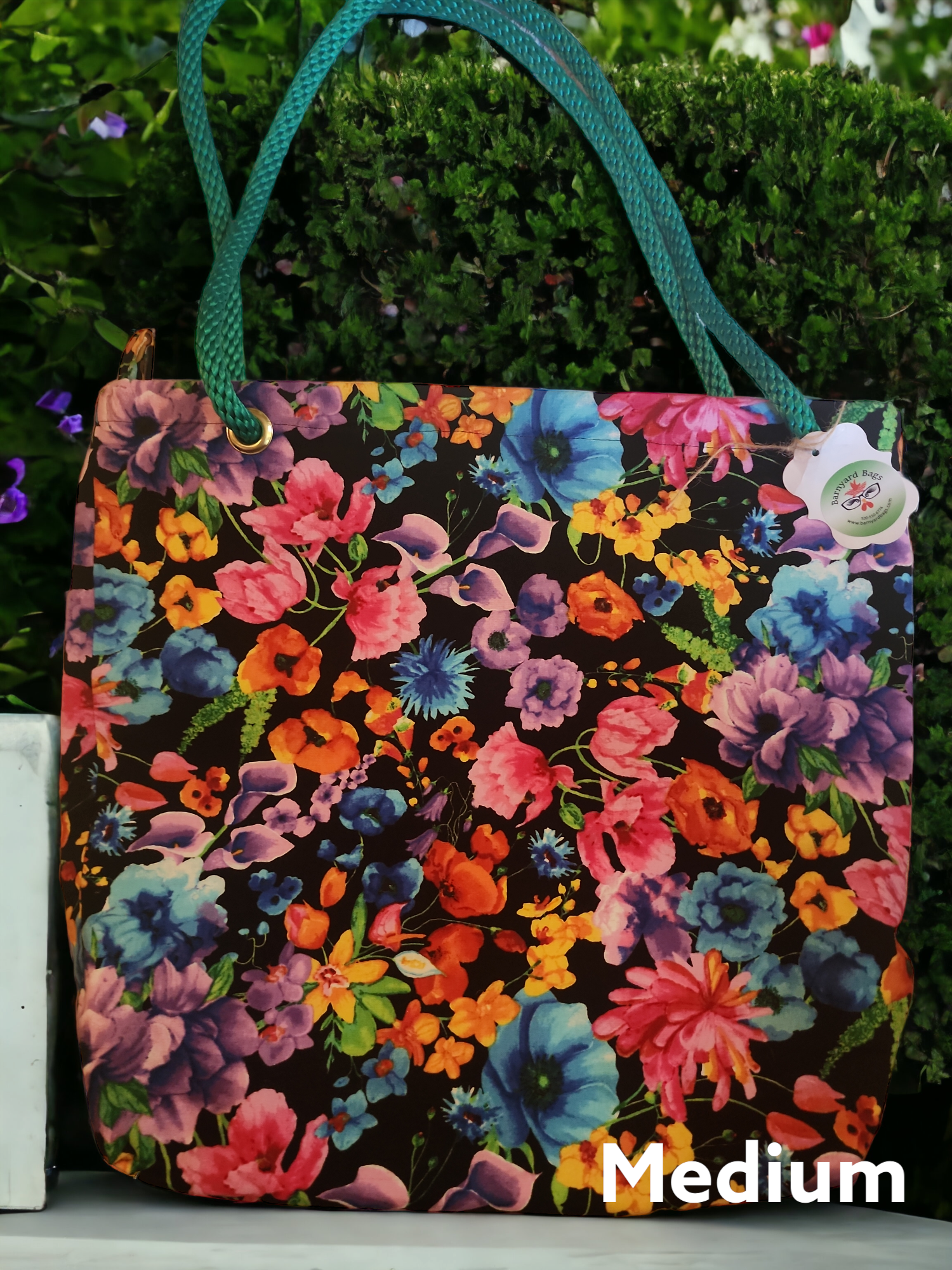 Medium-sized pretty flowers bag with green rope handles 