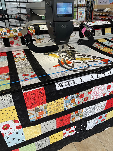 Quilting on the Bernina Qmatic at the Stitch House.