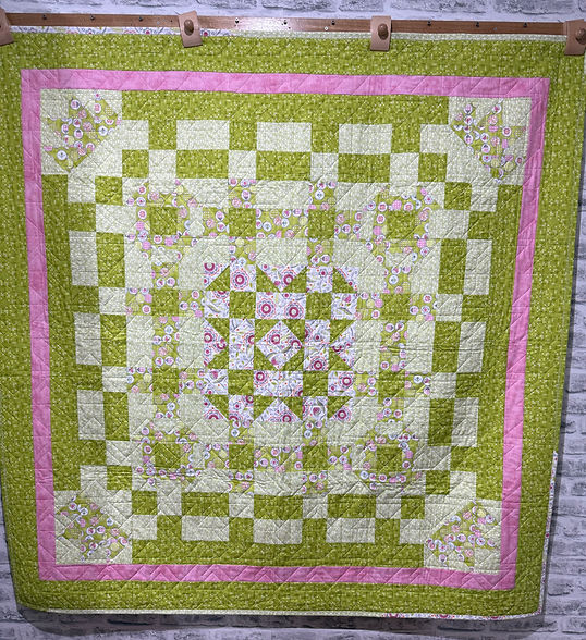 pink contrasts well with the green in this quilt