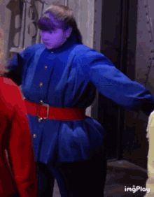 Violet of the reality show "Willy Wonka's Child Factory" busting her belt while converting into an adult blueberry.