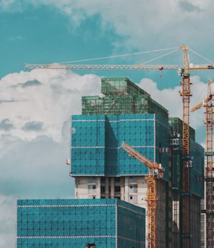 Construction site with cranes and building