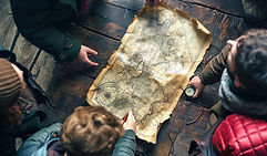 credis27_a_group_of_people_studying_the_treasure_map_style_raw__0efc8749-90b9-4591-9c6b-87