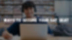Student with headphones studying in a library, showing strategies to secure an SAT seat when test centers are already full.