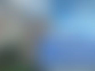 Stone campus building at Washington University in St. Louis under blue sky with text promoting a guide on applying to WashU.