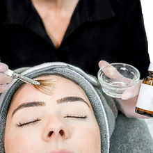 Client receiving a professional chemical peel treatment at Pretty in Ink Cosmetics in Cheltenham