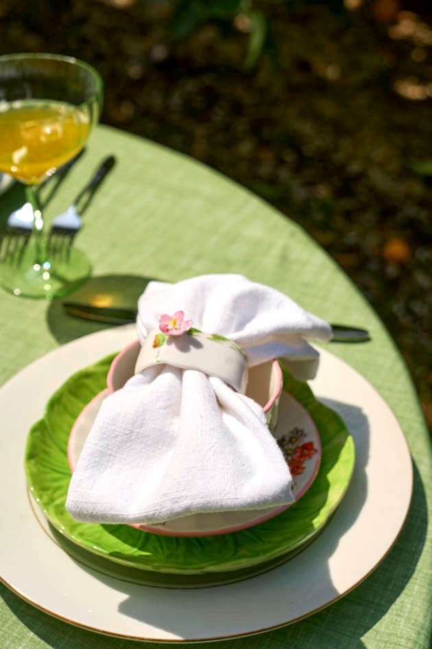 Linen napkins with napkin holders. Napkin holders were found at a vintage shop.