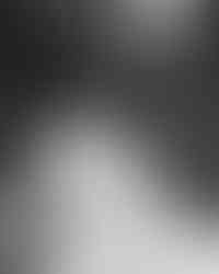 Bride laughing during solo wedding portraits outdoors at Southall Meadows, captured candidly in a documentary wedding style