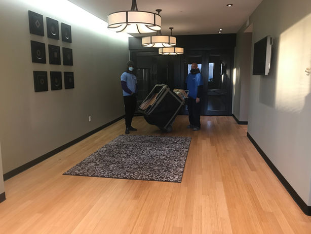 Assured Logistics Group wrapping sofas for commercial move in Englewood NJ