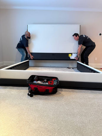 Assured Logistics Group in action moving a bed frame (king size).