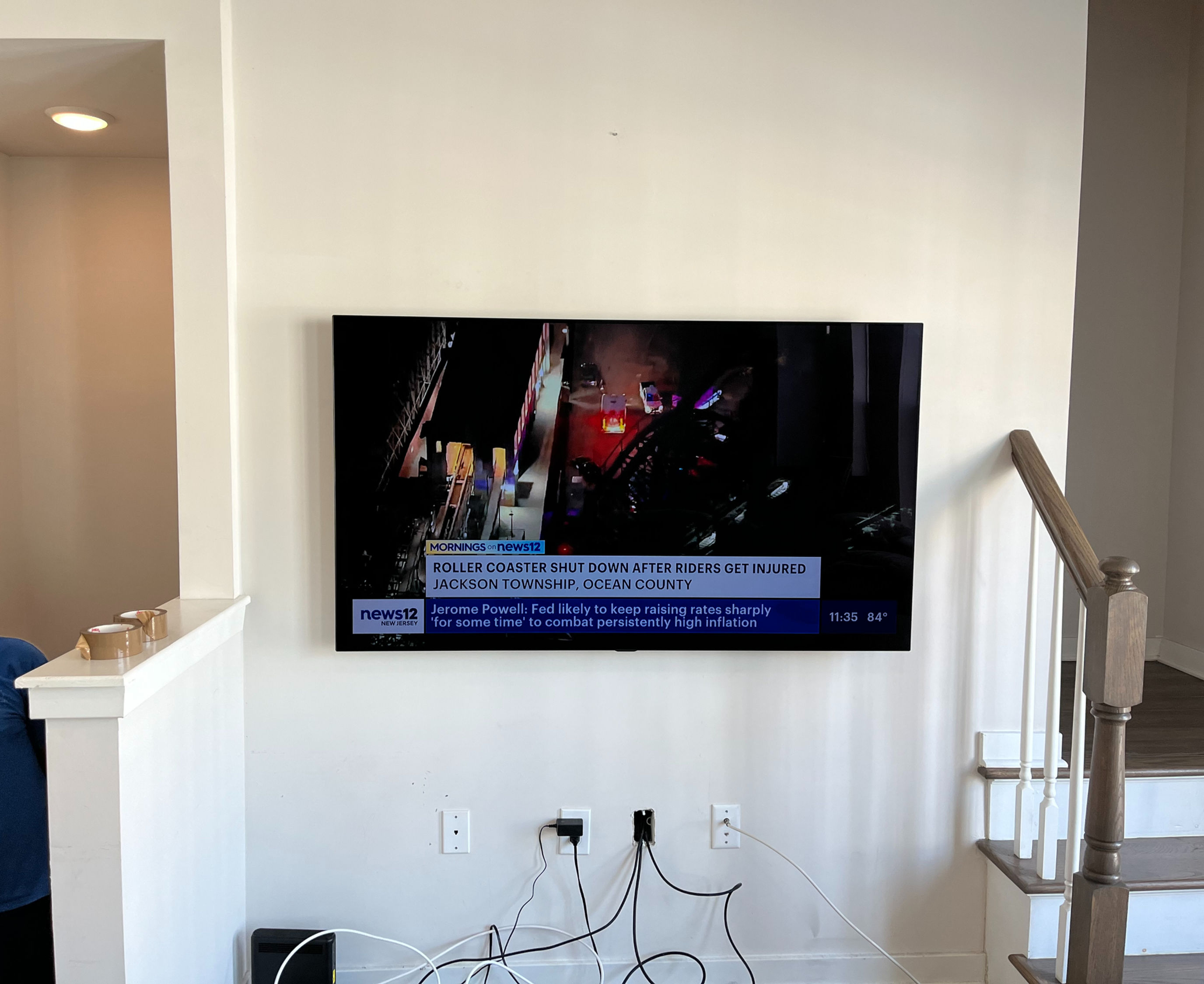 Modern living room with mounted TV, fireplace; Professional TV Mounting in Central NJ.