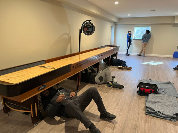Assured Logistics Group reassembling lower portion of a 12 ft Hudson shuffleboard.