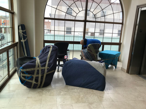 Assured Logistics Group wrapping furniture for commercial move in Englewood NJ