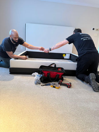 Assured Logistics Group in action disassembling a bed frame (king size).