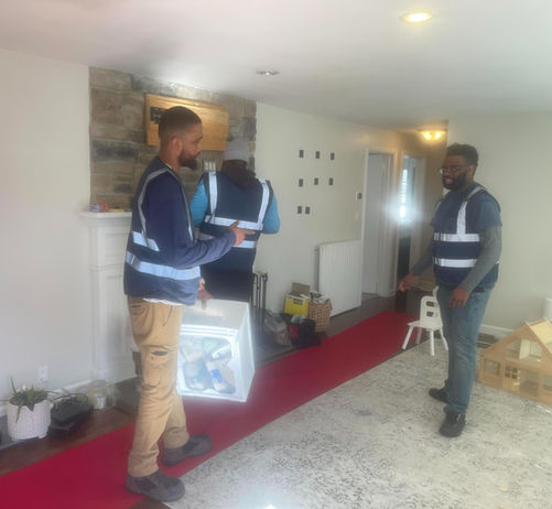 Assured Logistics Group wrapping furniture and TV dismounting for moving.