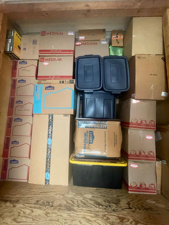 Container packed with boxes and blanket wrapped furniture by Assured Logistics Group in Fords NJ