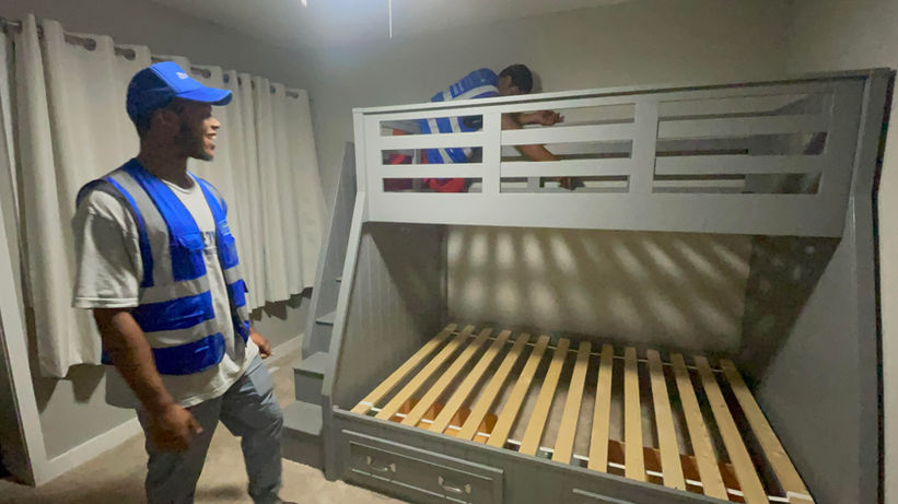 Assured Logistics Group in action assembling large bunk beds.