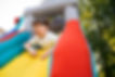low-angle-smiley-boy-bounce-house.jpg