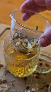 Thumbnail: brewing loose tea in a glass cup mug with strainer infuser