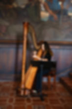 Harpist Valerie Saint Martin performing at the Santa Barbara Courthouse Mural Room. Photography by LoveSaver Wedding 
