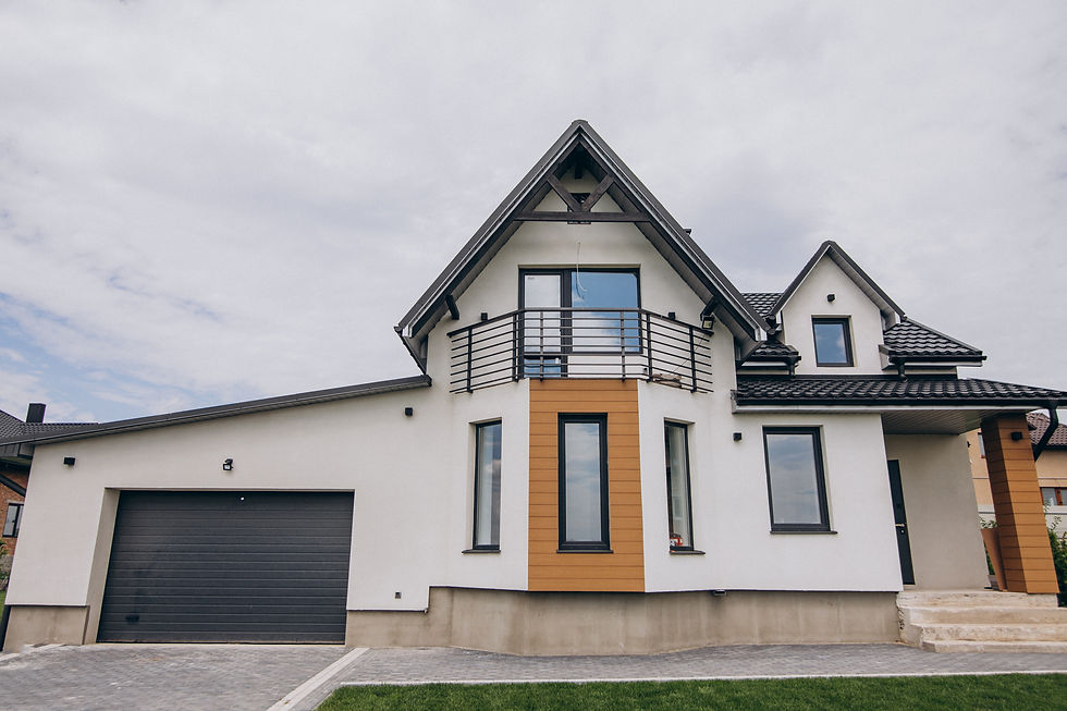 Home extension with a dormer window and a contemporary feature balcony, with off-white rendered walls