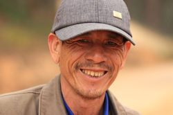 Lê Đức Anh smiling