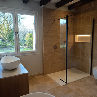 Contemporary country bathroom with walk-in shower, oak vanity and natural stone finishes